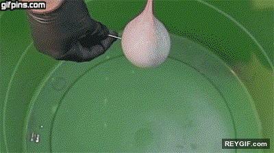 GIF animado (93249) Explotando un globo de agua lleno de mercurio en un barreno a camara lenta